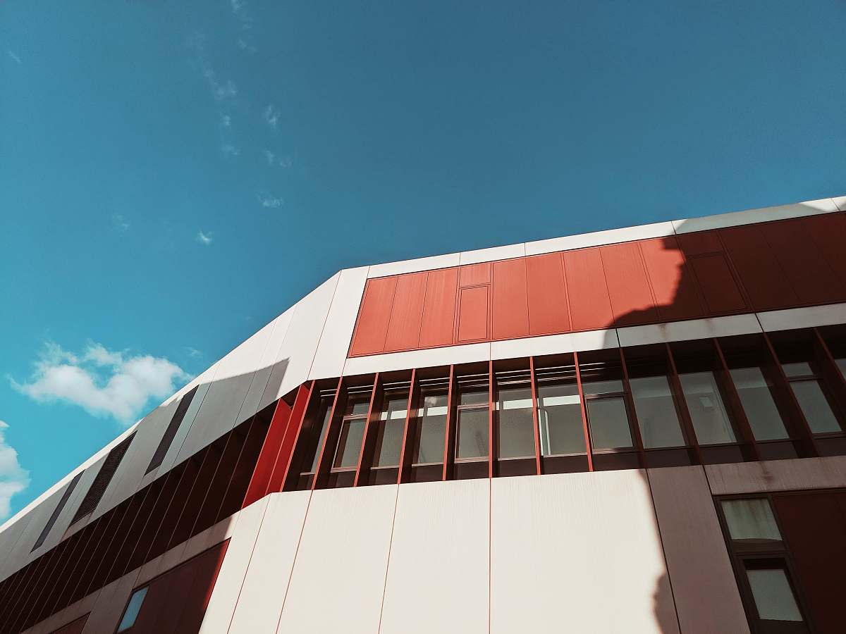 office building white and red building architecture